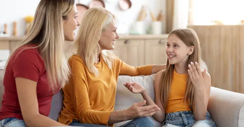 cute-preteen-blonde-girl-sharing-secrets-with-mom-granny