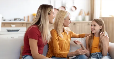 cute-preteen-blonde-girl-sharing-secrets-with-mom-granny