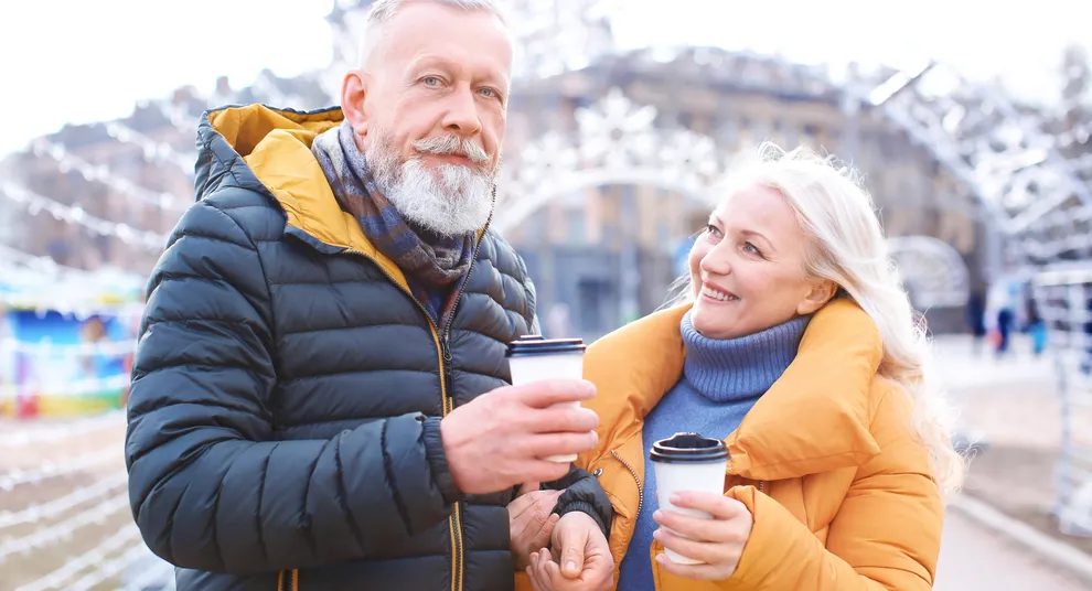 happy-mature-couple-with-coffee-outdoors