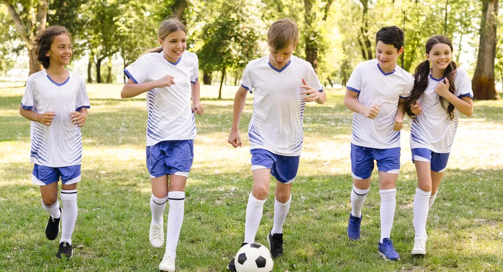kids-playing-football-outdoors