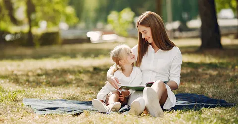 mother-with-little-daughter-sitting-plaid-read-book