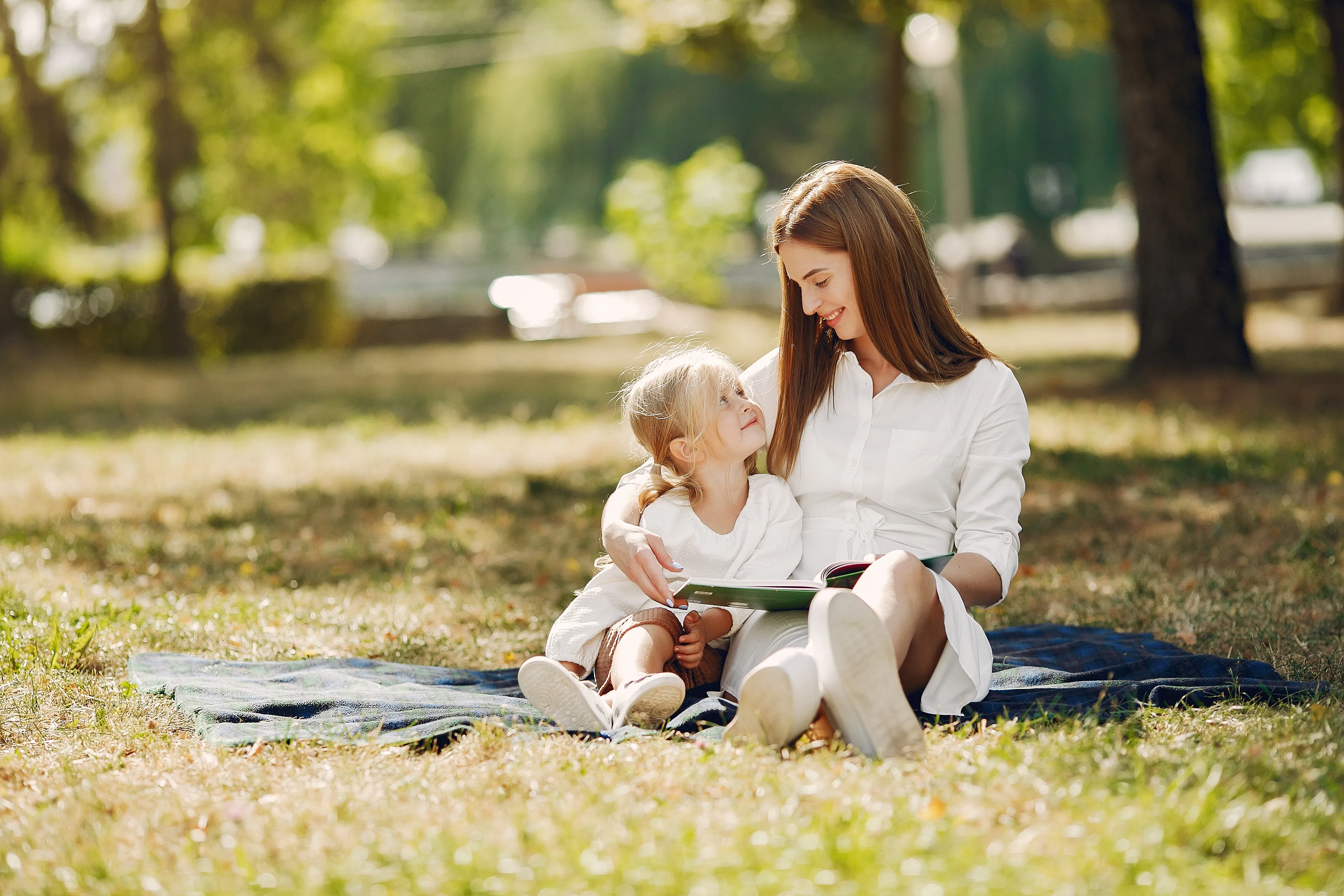 mother-with-little-daughter-sitting-plaid-read-book