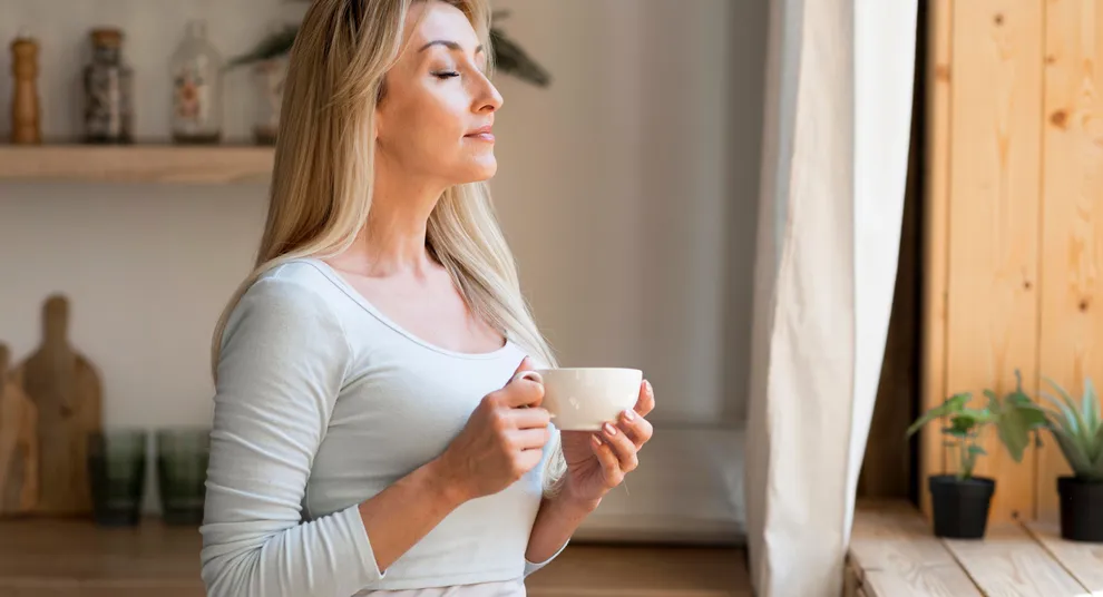 side-view-young-mother-enjoying-cup-coffee