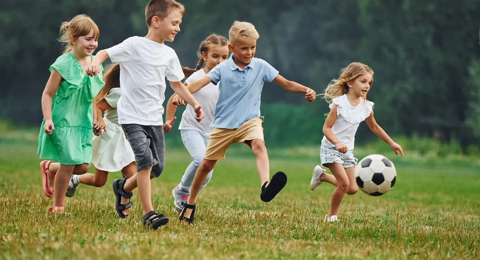 soccer-ball-playing-together-kids-are-having-fun-field-daytime